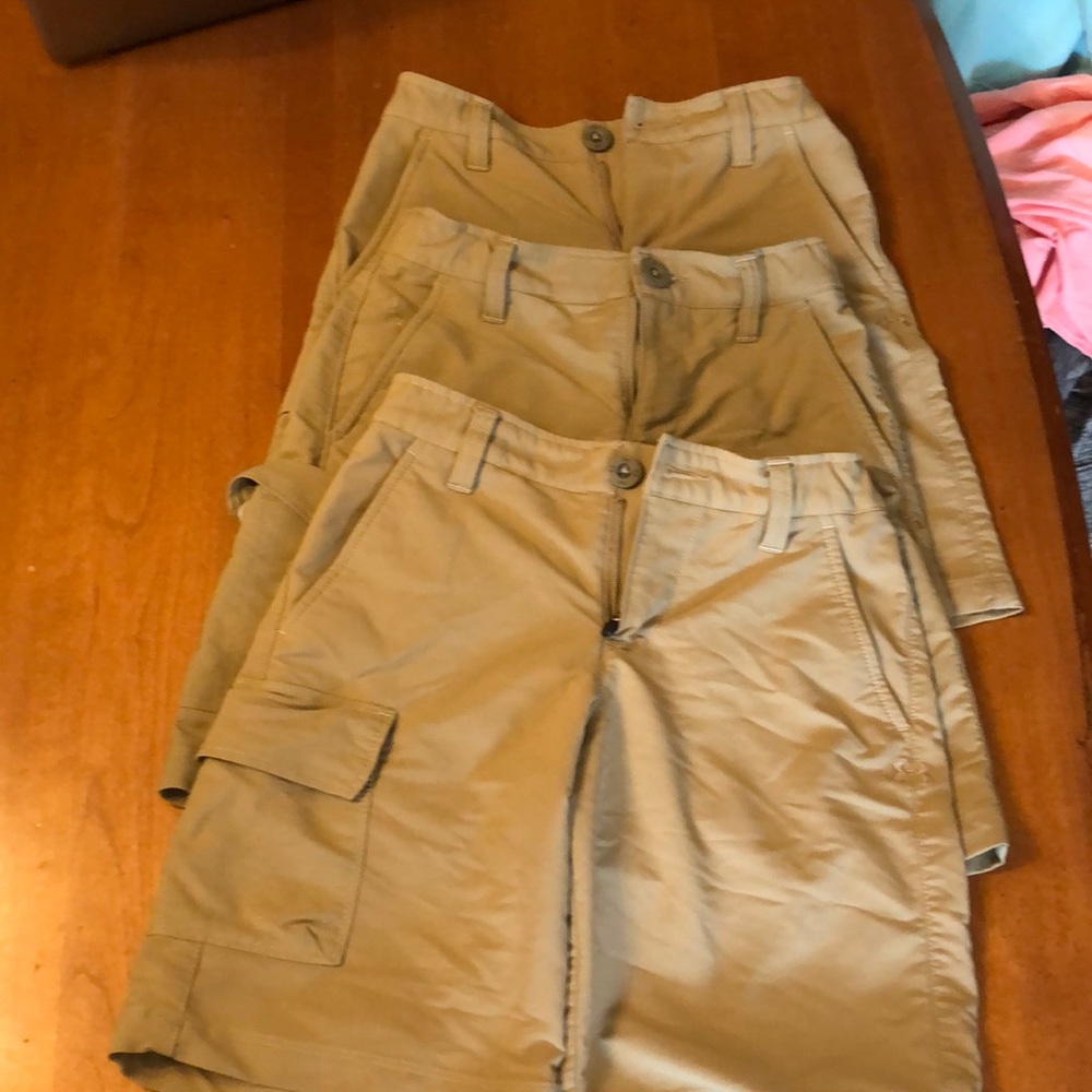 3 pairs Youth cargo golf shorts dry fit. Youth small.  Bundle of 3 shorts .